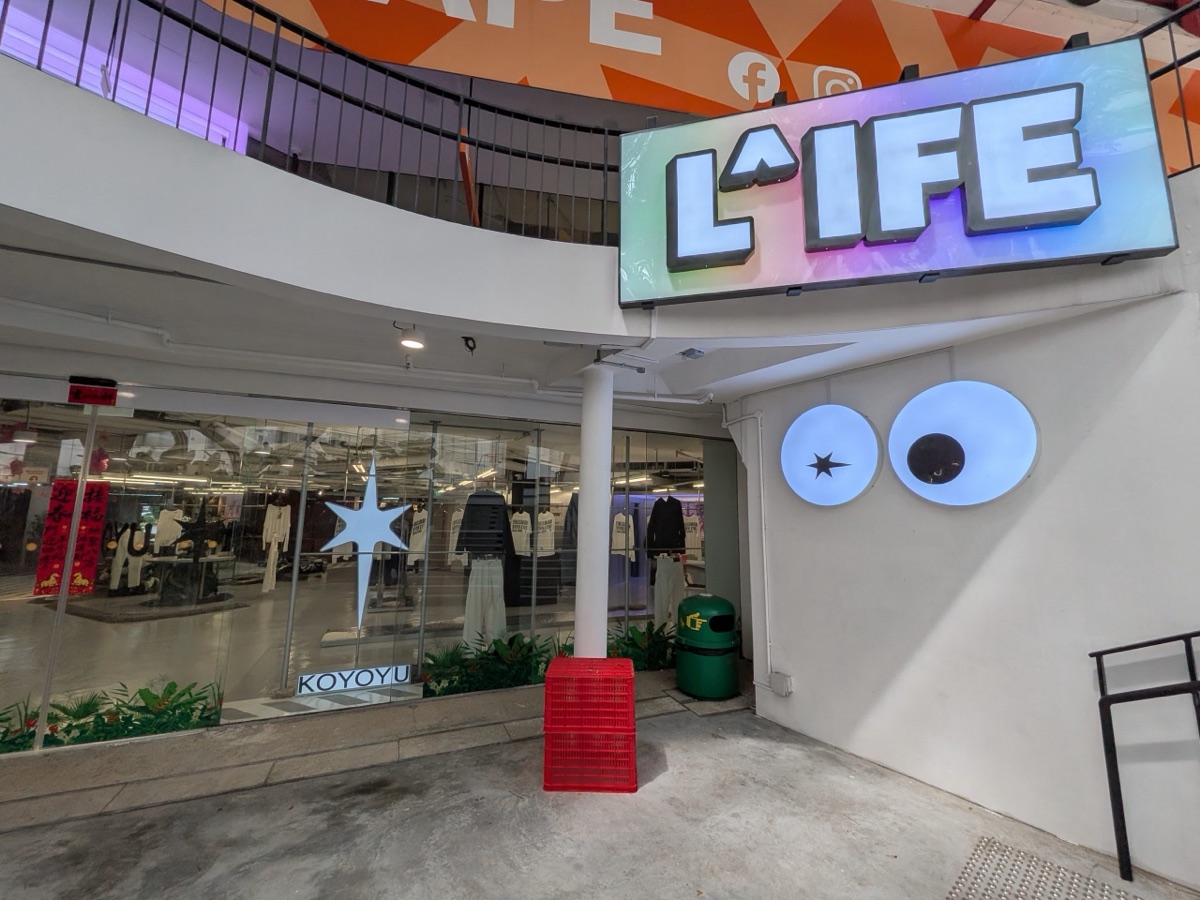 L^IFE Singapore storefront at *SCAPE with illuminated logo signage and googly-eye light features
