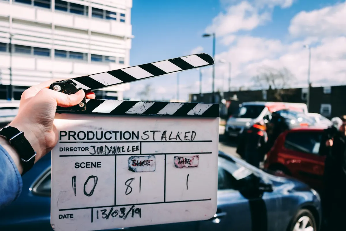 On set during a brand shoot, camera and lighting rig in warm tungsten light